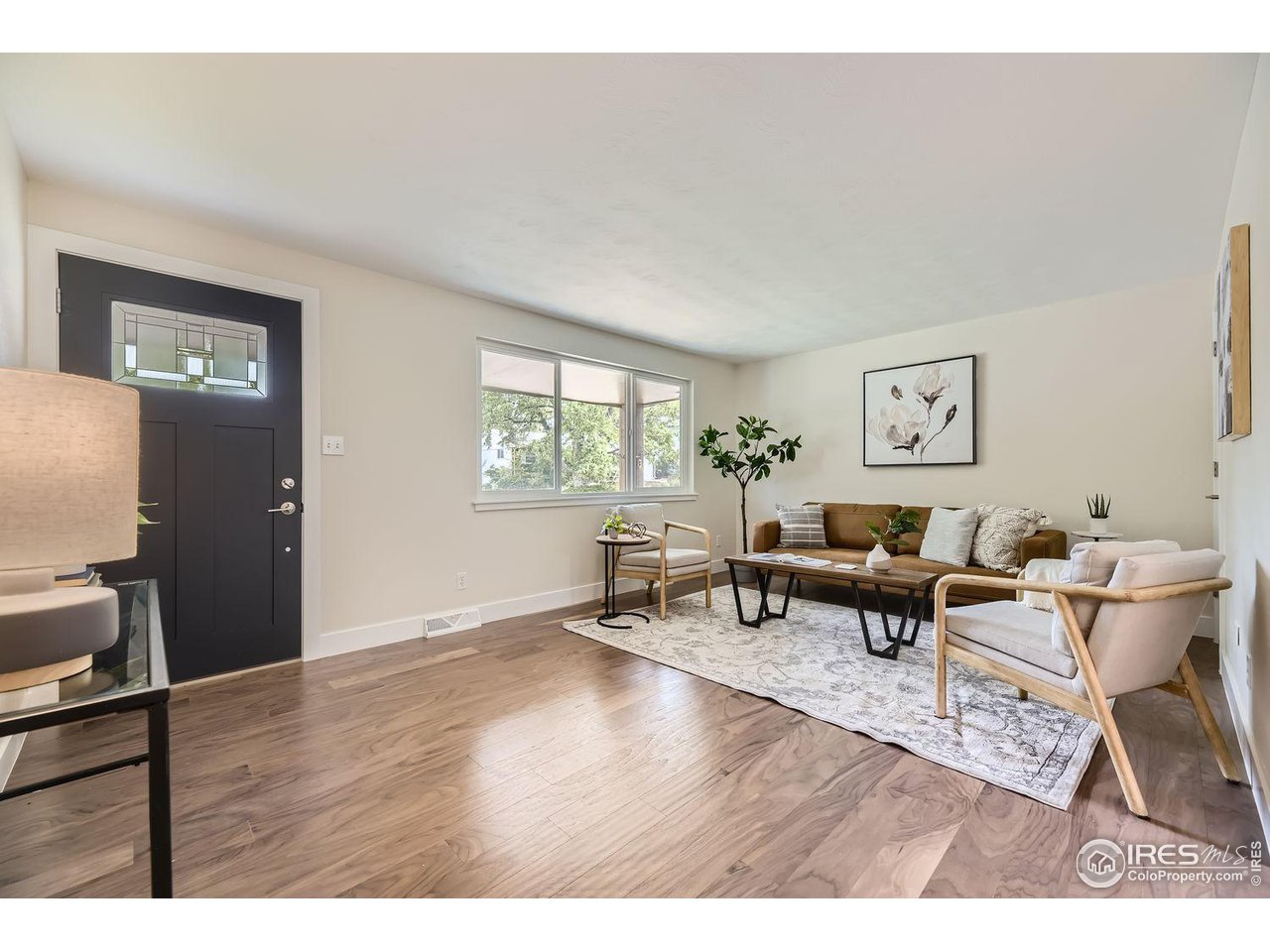 1505 Findlay Way Boulder, CO 80305 - Photo 5 of 31 a living room with furniture and a wooden floor