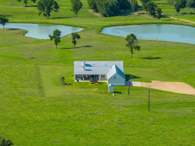 a view of a golf course with chairs