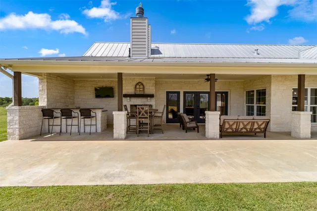 a view of a swimming pool with outdoor seating