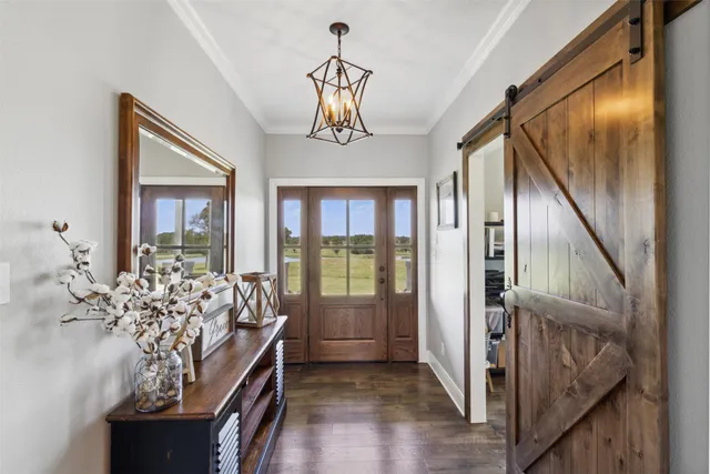 a view of front door and bedroom