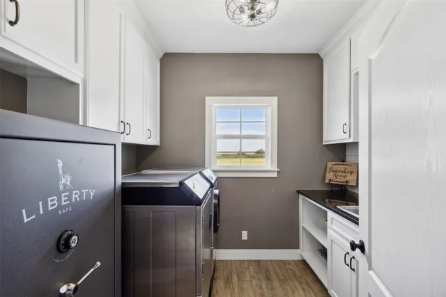 a kitchen with granite countertop a refrigerator and a stove