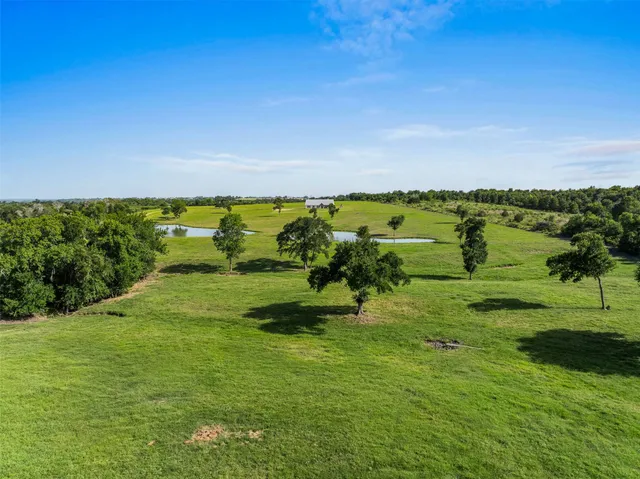 a view of a lake with houses in all around