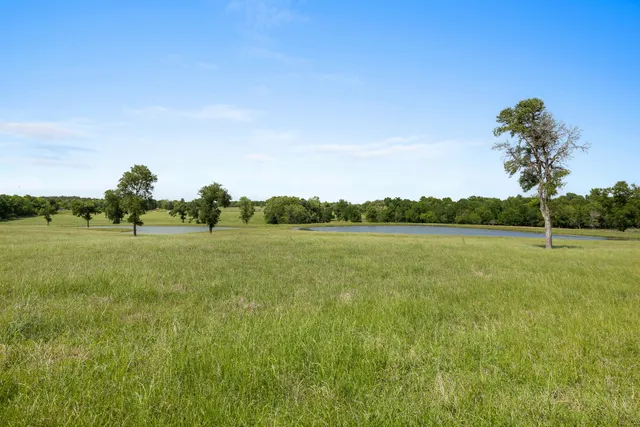 a view of a lake view with a big yard