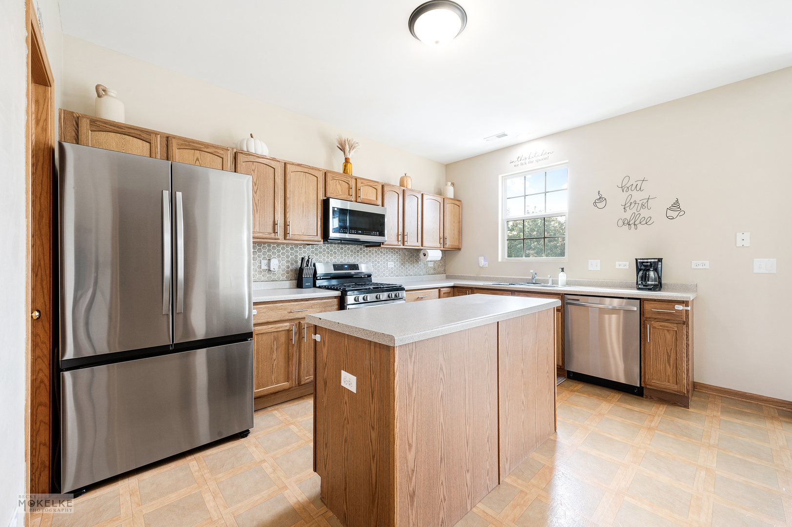 264 South Alder Creek Drive Romeoville, IL 60446 - Photo 2 of 26 a kitchen with a refrigerator sink and microwave