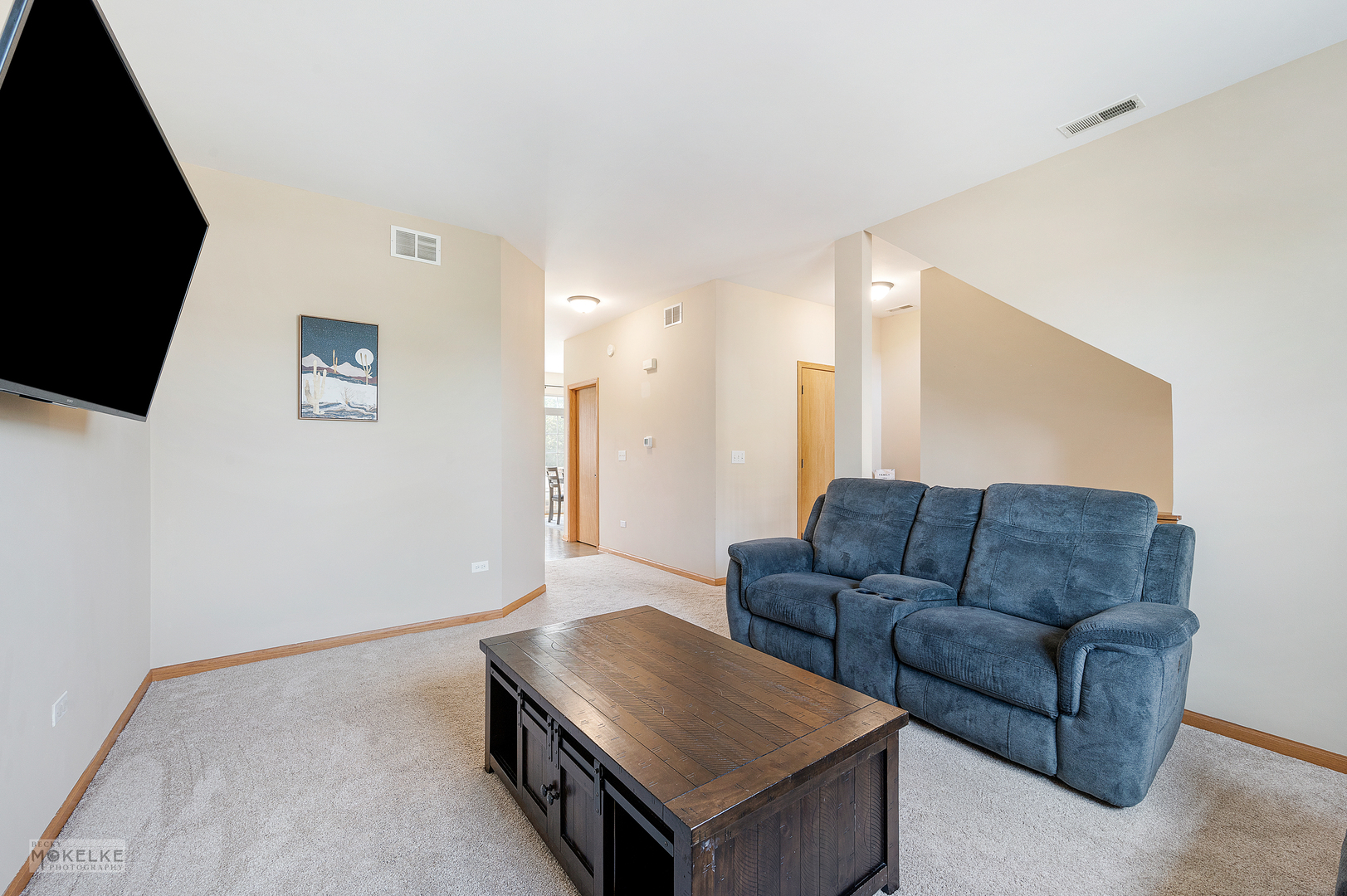 264 South Alder Creek Drive Romeoville, IL 60446 - Photo 7 of 26 a living room with furniture and a flat screen tv