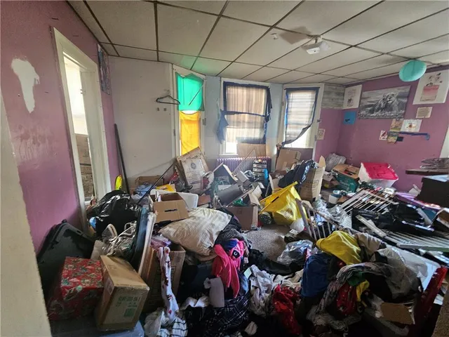 a gym room with gym equipment and windows