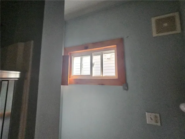 a view of a closet area with window