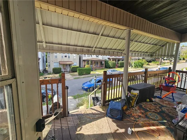 a view of a chairs and table in patio