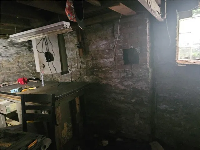 a bathroom with a shower and a mirror