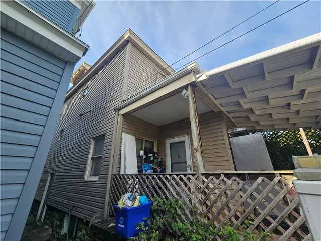 a view of a house with wooden stairs