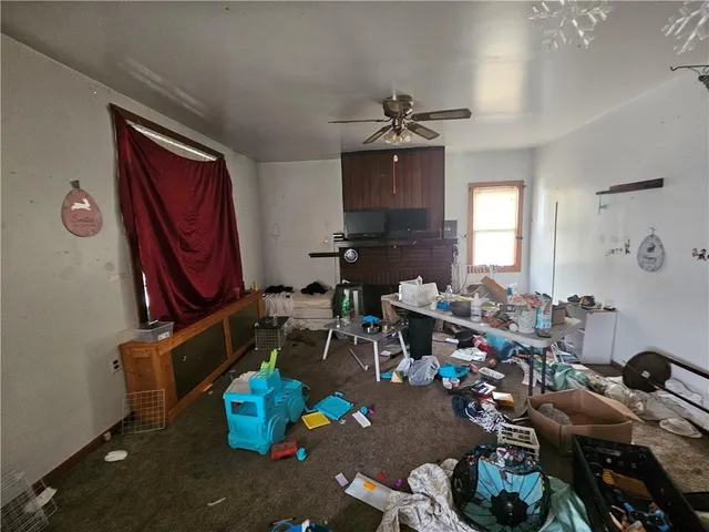 a room with furniture a chandelier and a window