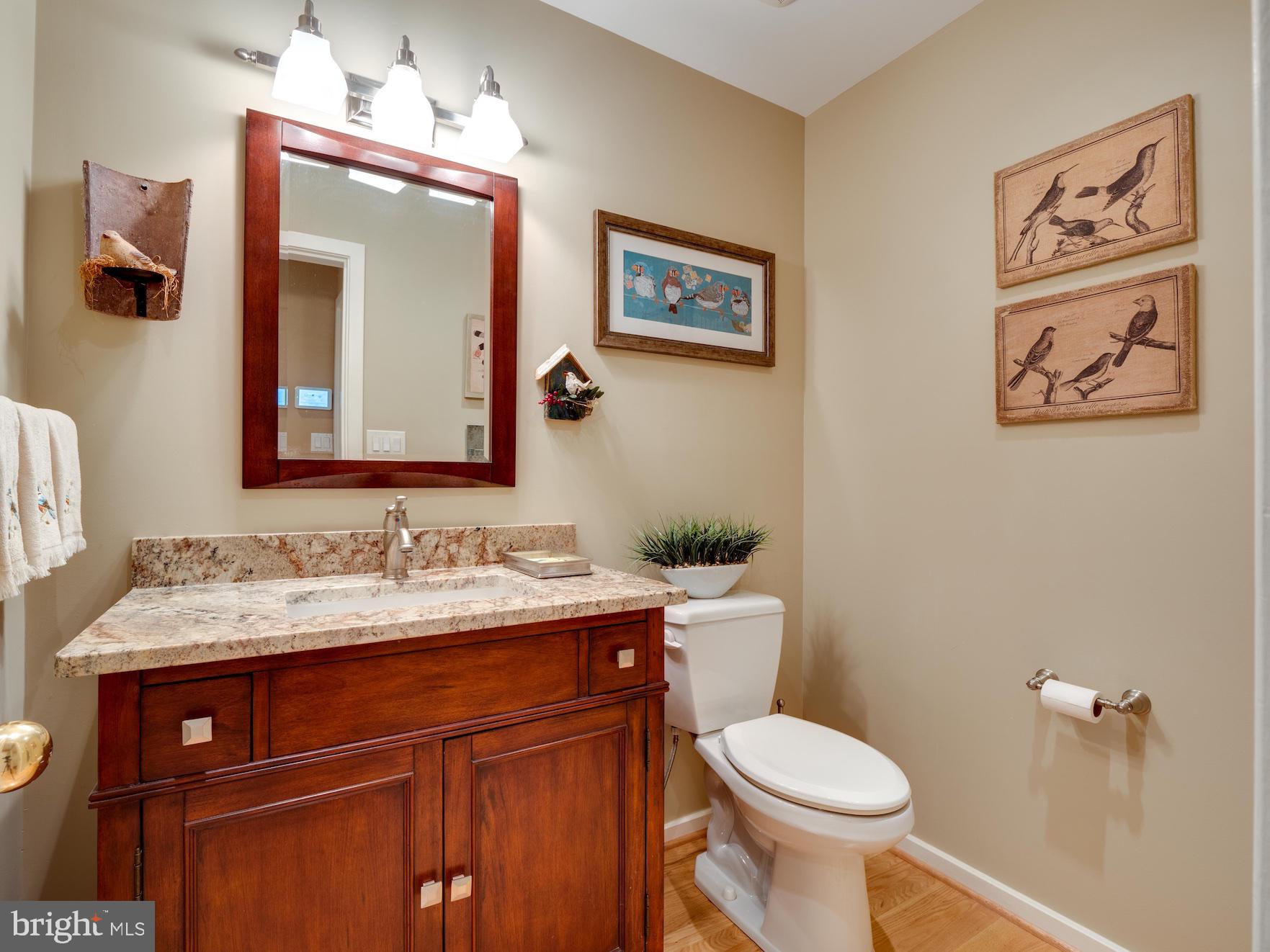 1407 Belcastle Court Reston, VA 20194 - Photo 34 of 42 Main level Power Room with hardwoods