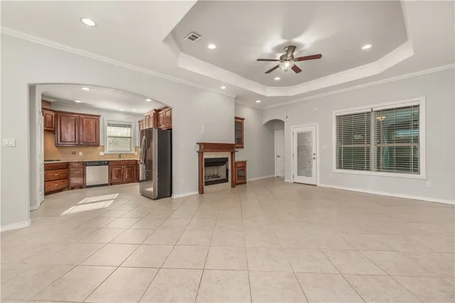 a view of a livingroom with furniture and a ceiling fan