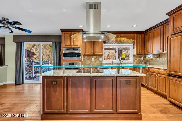 a kitchen with stainless steel appliances granite countertop a stove and a sink