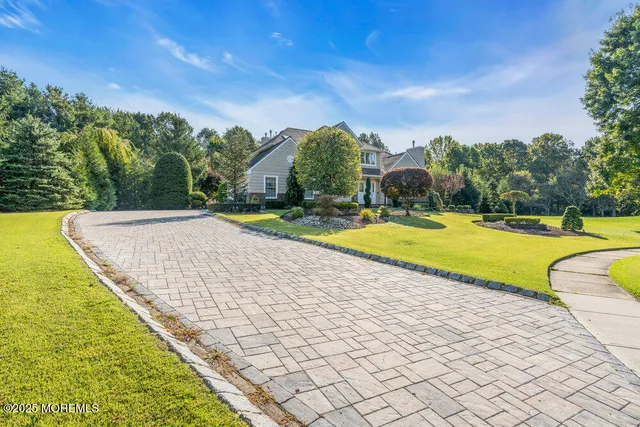 a view of a swimming pool with a yard