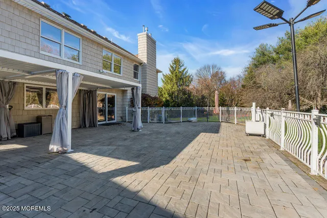 a view of a park with large trees