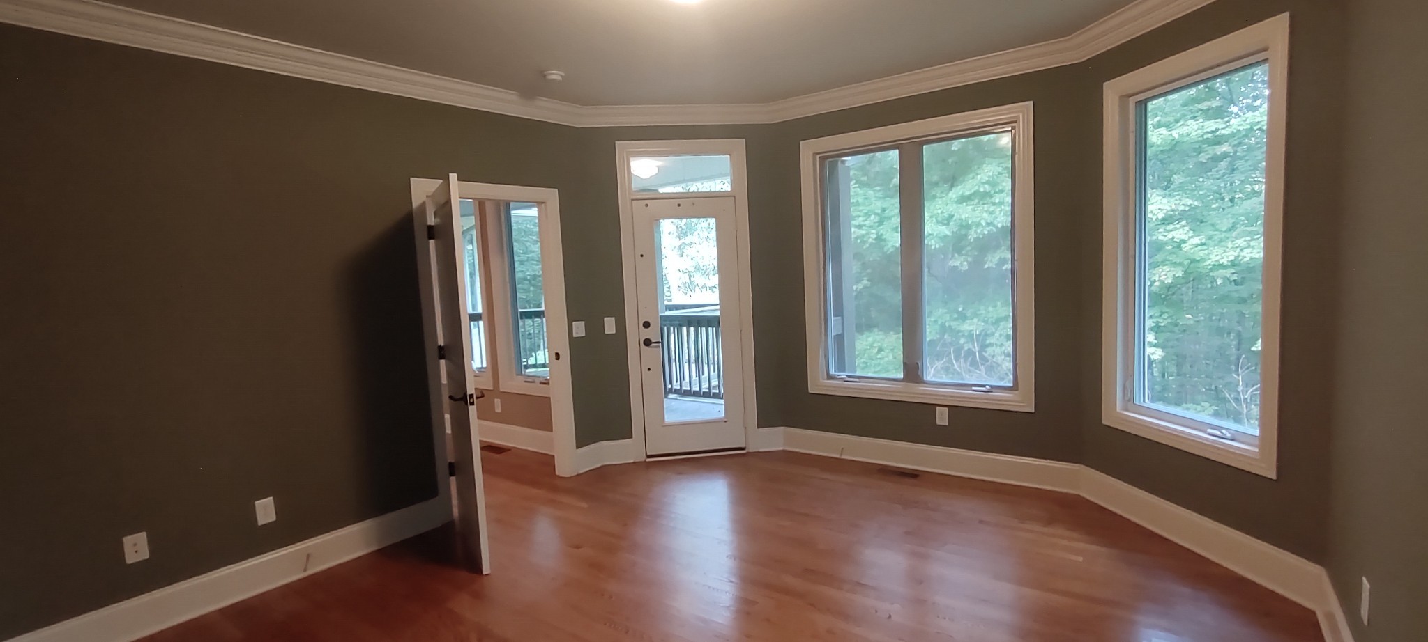 786 Old Sewanee Road Sewanee, TN 37375 - Photo 11 of 25 an empty room with wooden floor and windows