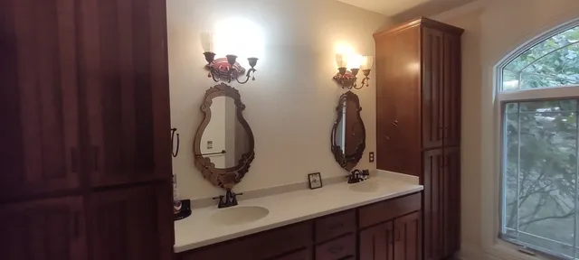 a bathroom with a sink and a mirror