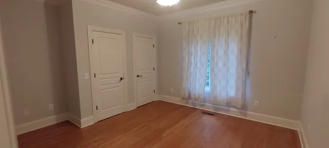 an empty room with a empty space and window