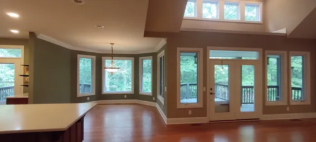 a view of a livingroom with furniture window and wooden floor