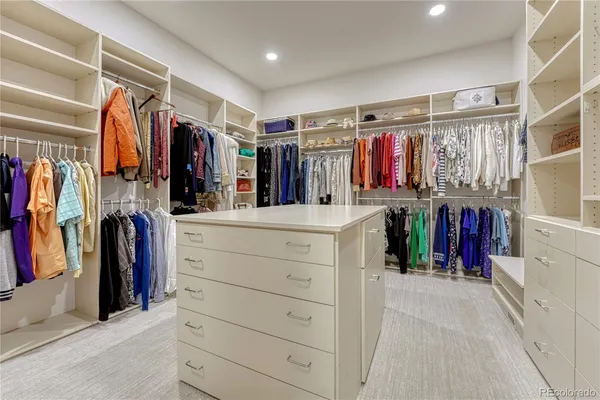 a bathroom with a sink vanity granite tub shower and a mirror