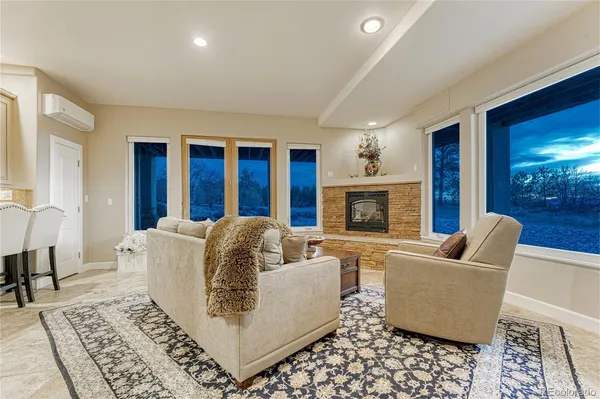 a kitchen with kitchen island a dining table chairs cabinets and stainless steel appliances