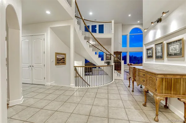 a view of an entryway with hallway and wooden floor