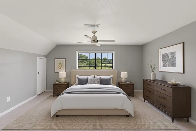 a bedroom with a bed and a window