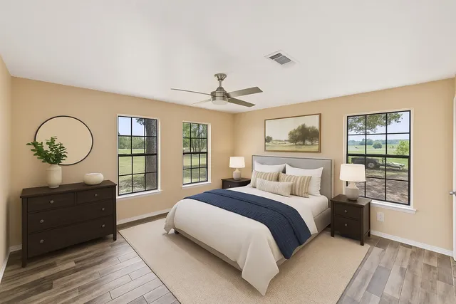 a bedroom with a large bed and a window