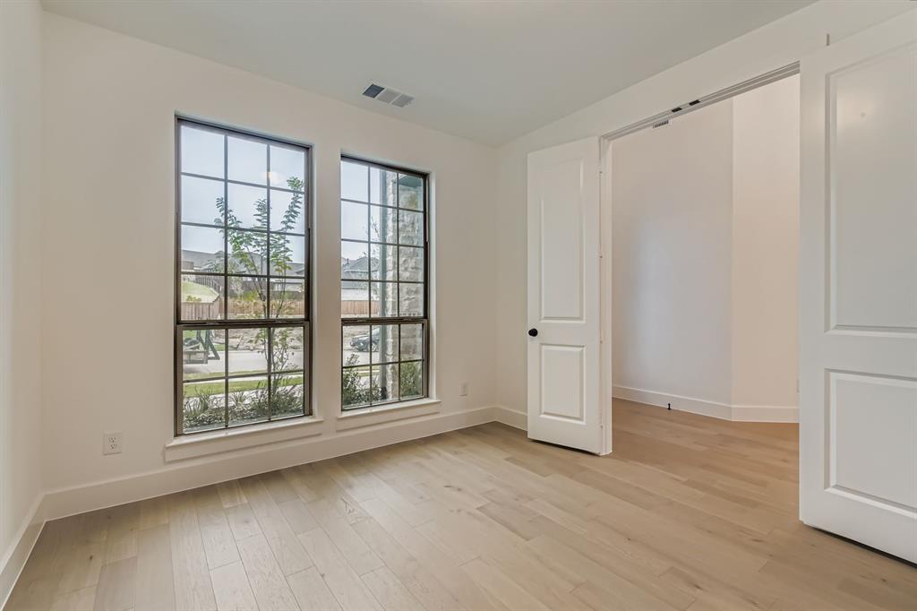 150 Longhorn Bend Rhome, TX 76078 - Photo 10 of 28 Unfurnished bedroom featuring light wood-style flooring and baseboards