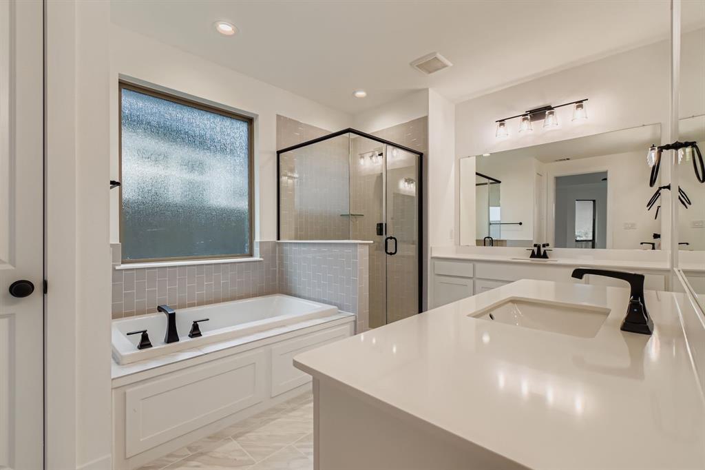 150 Longhorn Bend Rhome, TX 76078 - Photo 16 of 28 Full bath featuring vanity, a garden tub, a shower stall, and recessed lighting