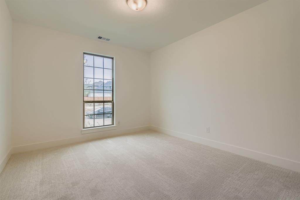 150 Longhorn Bend Rhome, TX 76078 - Photo 17 of 28 Unfurnished room featuring light carpet and baseboards