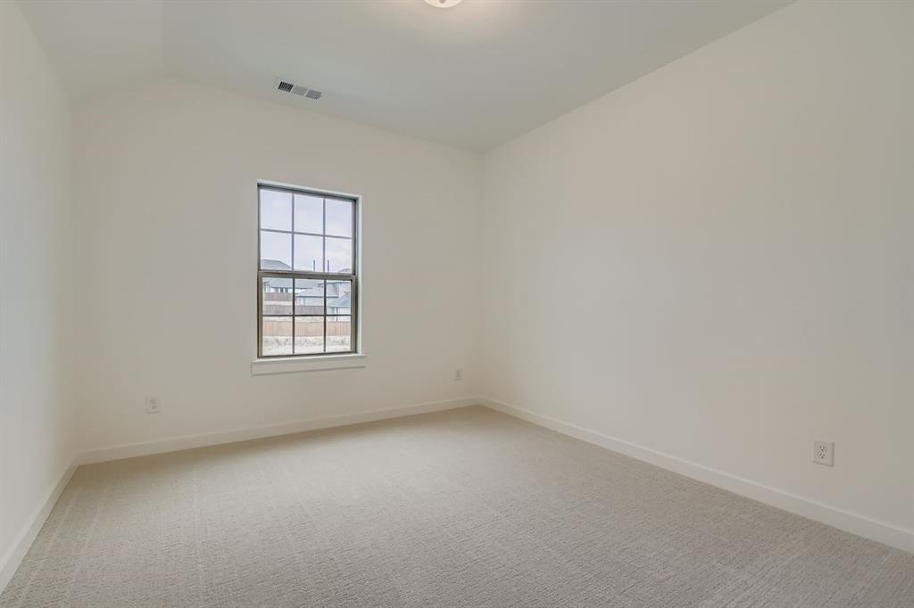 150 Longhorn Bend Rhome, TX 76078 - Photo 19 of 28 Empty room featuring light carpet and baseboards