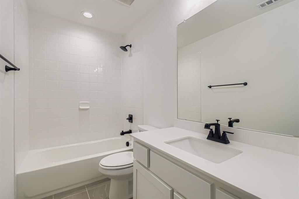 150 Longhorn Bend Rhome, TX 76078 - Photo 21 of 28 Bathroom with vanity, shower / bathtub combination, light tile patterned flooring, and recessed lighting