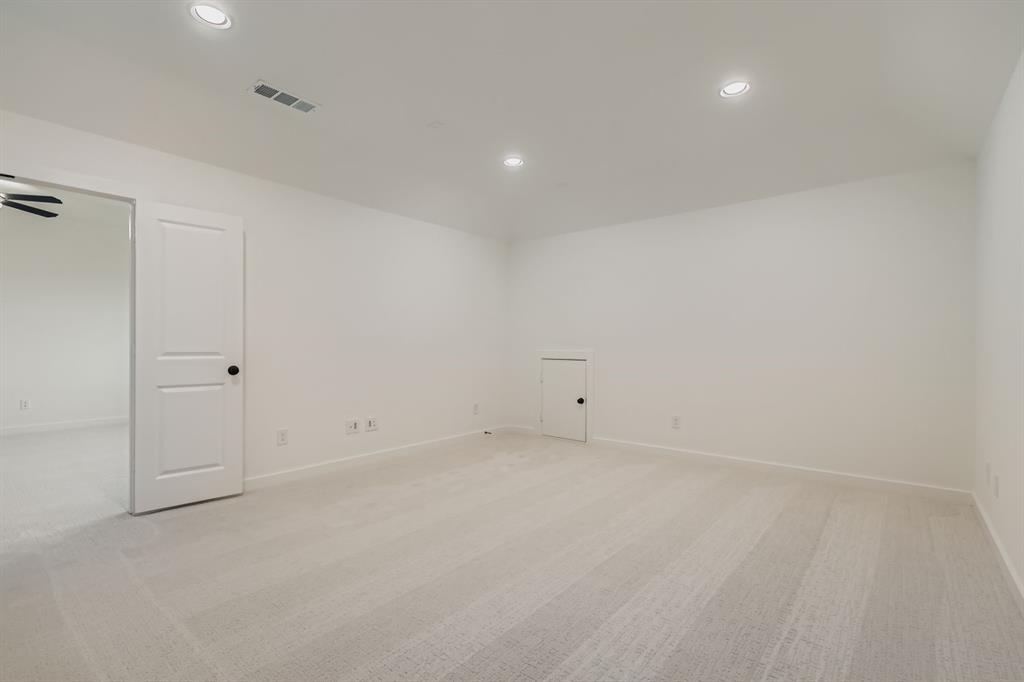 150 Longhorn Bend Rhome, TX 76078 - Photo 23 of 28 Empty room with light carpet and recessed lighting