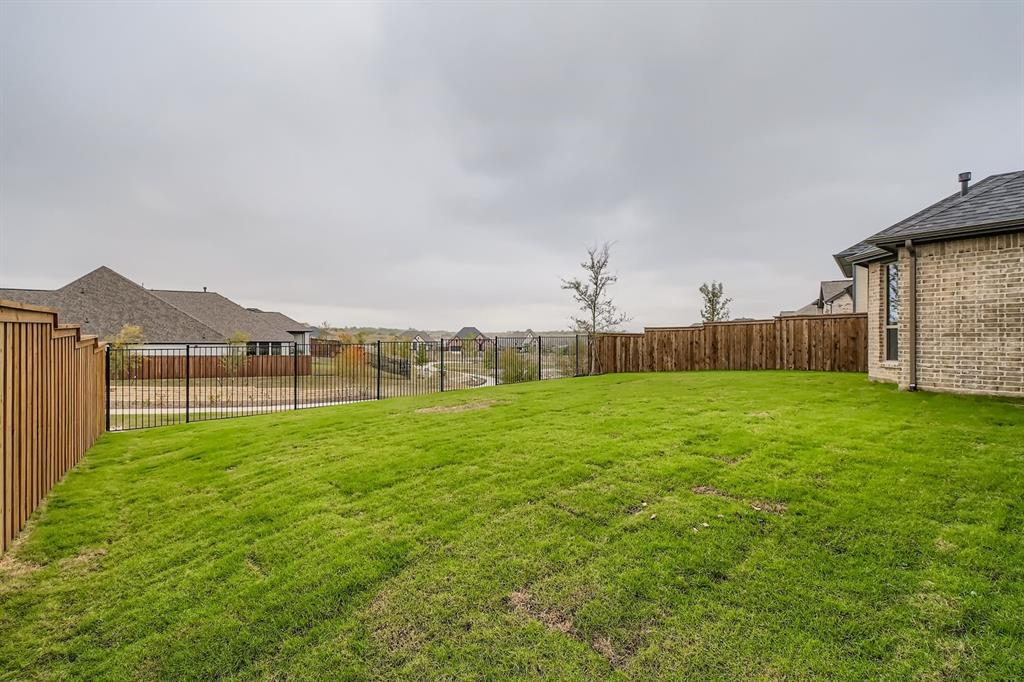 150 Longhorn Bend Rhome, TX 76078 - Photo 25 of 28 View of fenced backyard