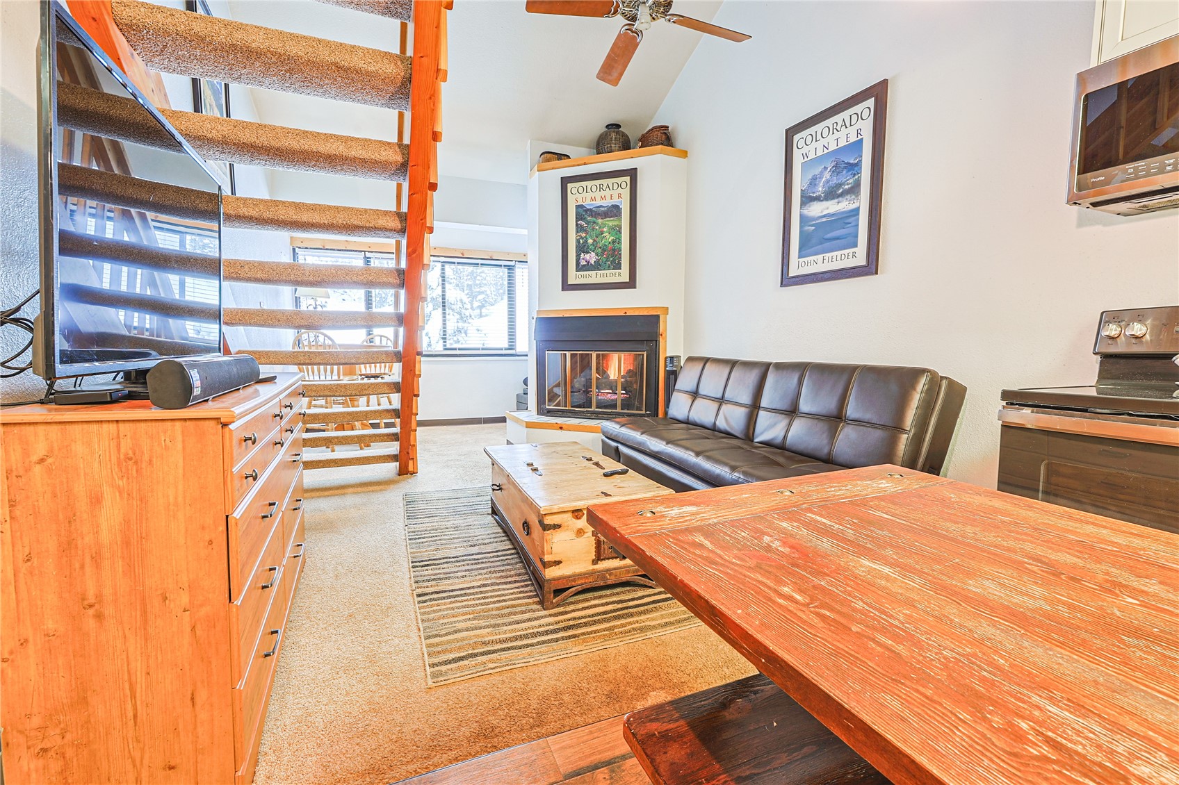 214 Ten Mile Circle, Unit R310 Copper Mountain, CO 80443 - Photo 4 of 15 a bedroom with a bed and wooden floor