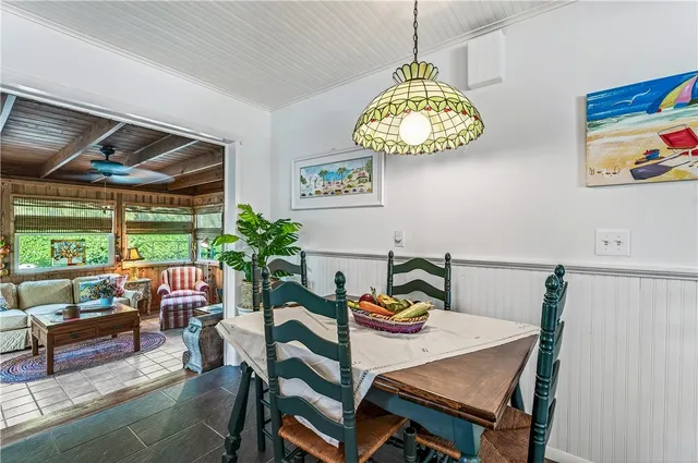 a bedroom with furniture and a flat screen tv