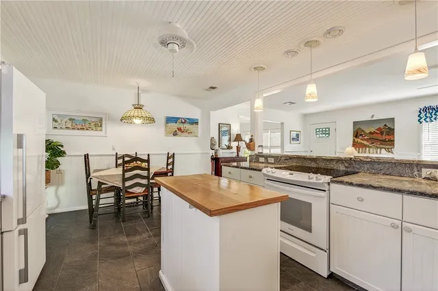 a bedroom with a bed wooden floor and a table