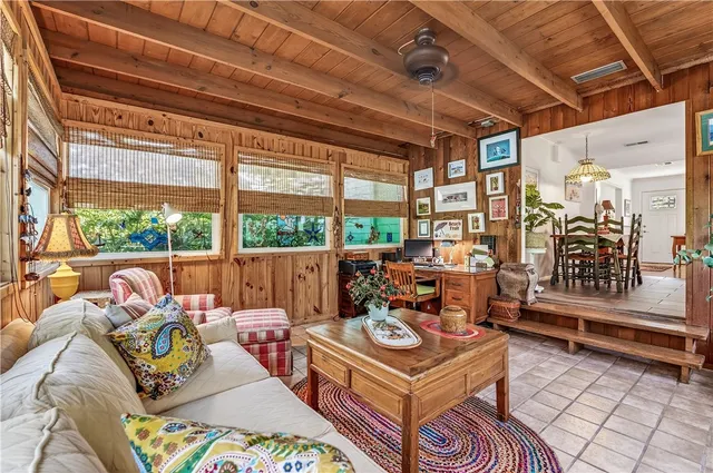 a bedroom with furniture and flat screen tv