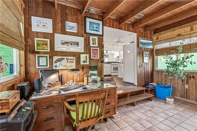 a view of a patio with table and chairs and potted plants