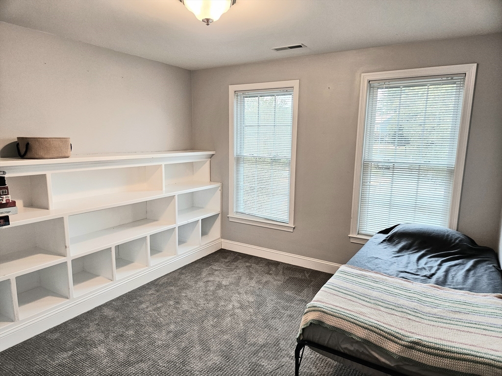 11 Bunting Way Danvers, MA 01923 - Photo 26 of 42 a view of a bedroom with furniture and windows