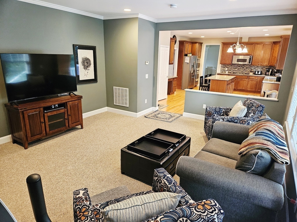 11 Bunting Way Danvers, MA 01923 - Photo 10 of 42 a living room with furniture and a flat screen tv