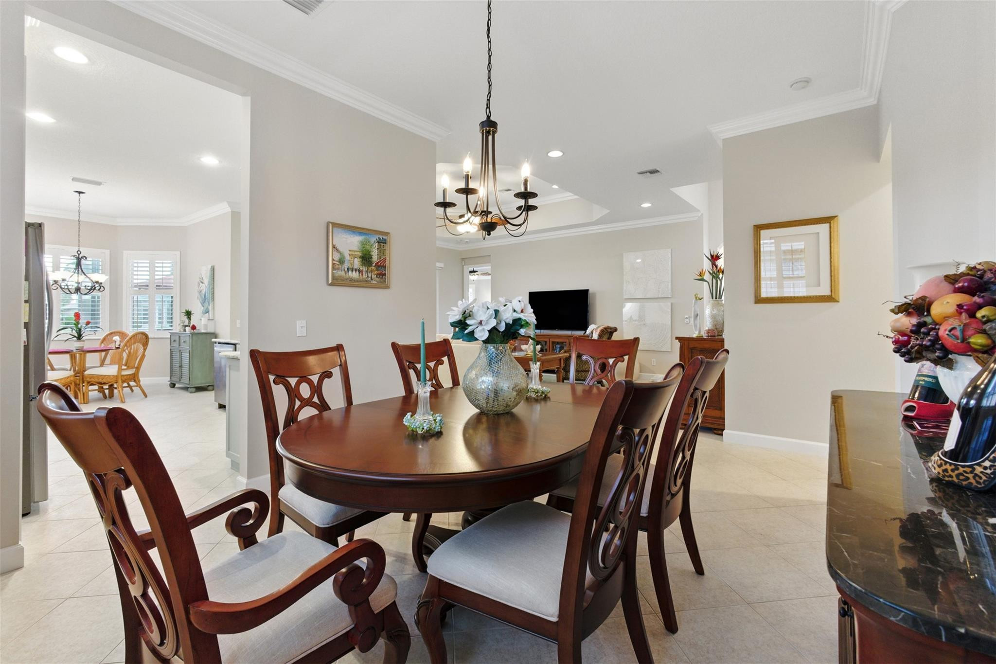 8836 First Tee Road Port St. Lucie, FL 34986 - Photo 12 of 35 a view of a dining room with furniture and wooden floor
