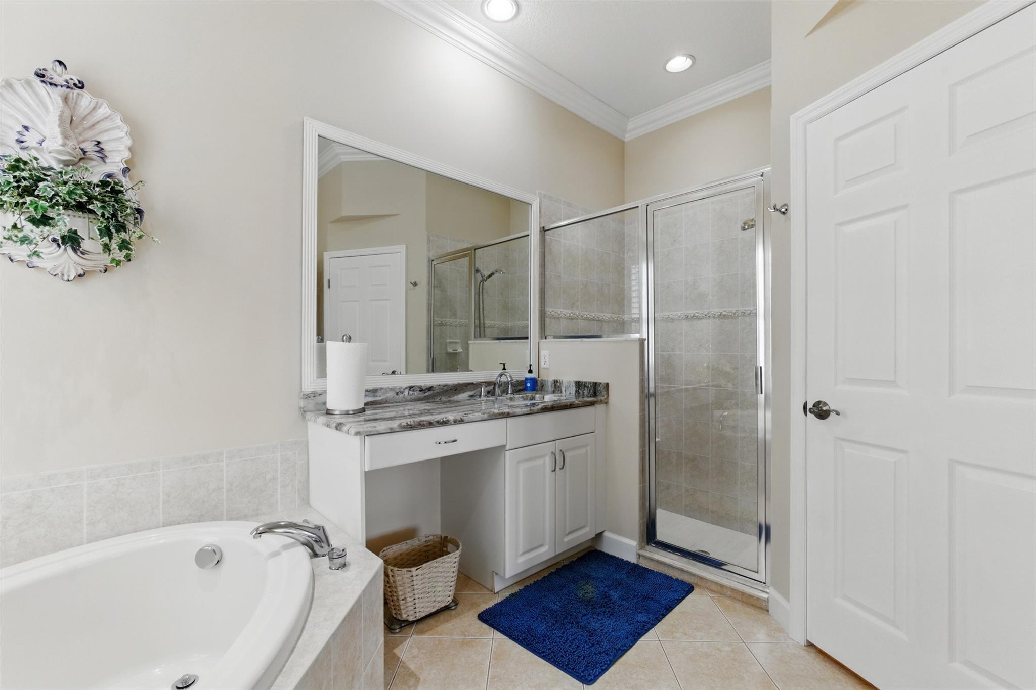 8836 First Tee Road Port St. Lucie, FL 34986 - Photo 15 of 35 a bathroom with a bathtub and a sink