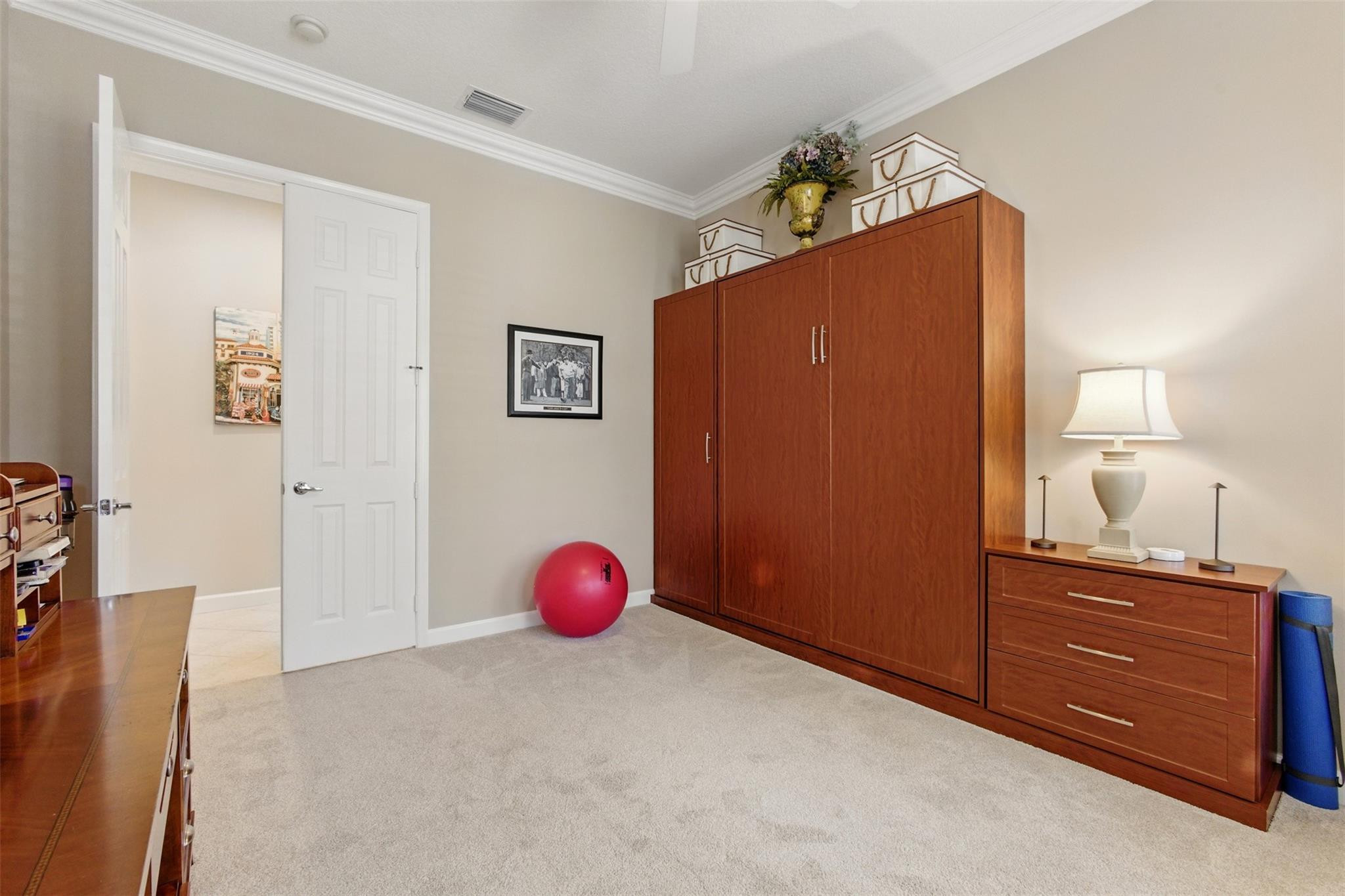 8836 First Tee Road Port St. Lucie, FL 34986 - Photo 21 of 35 a view of a livingroom with a dresser