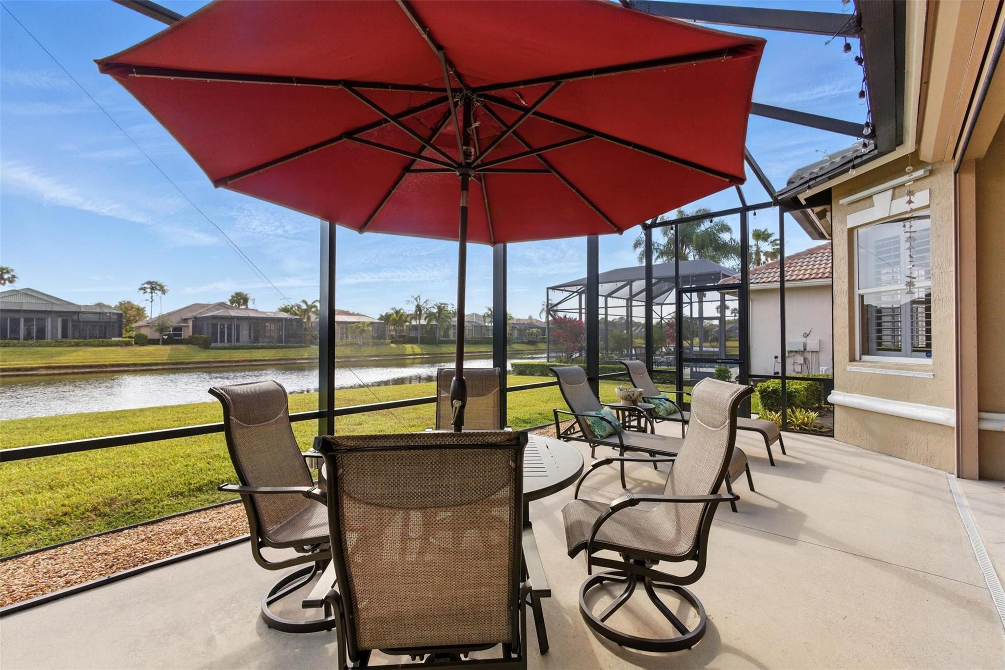 8836 First Tee Road Port St. Lucie, FL 34986 - Photo 24 of 35 a view of chairs and table in the patio
