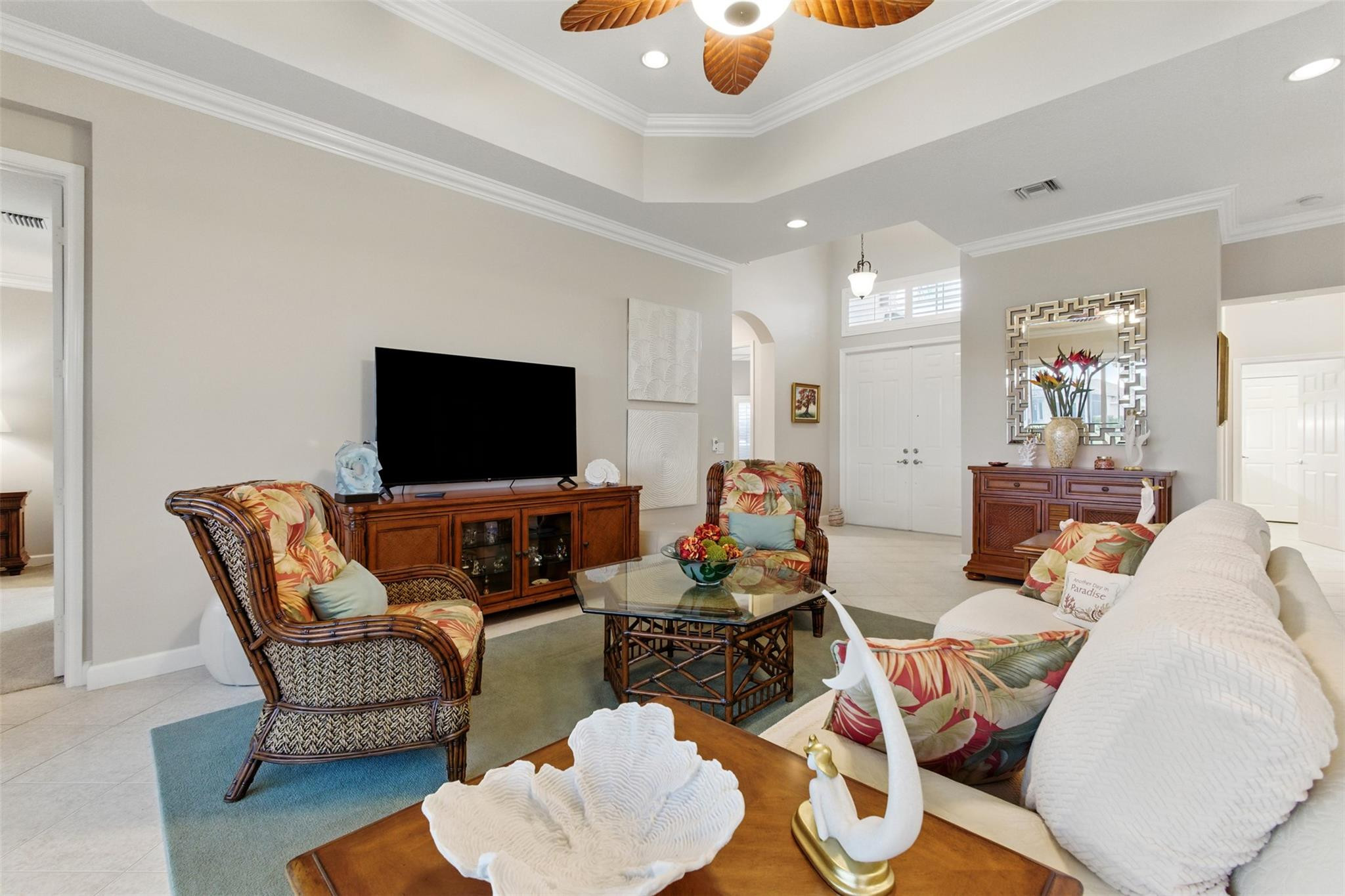 8836 First Tee Road Port St. Lucie, FL 34986 - Photo 6 of 35 a living room with furniture and a flat screen tv