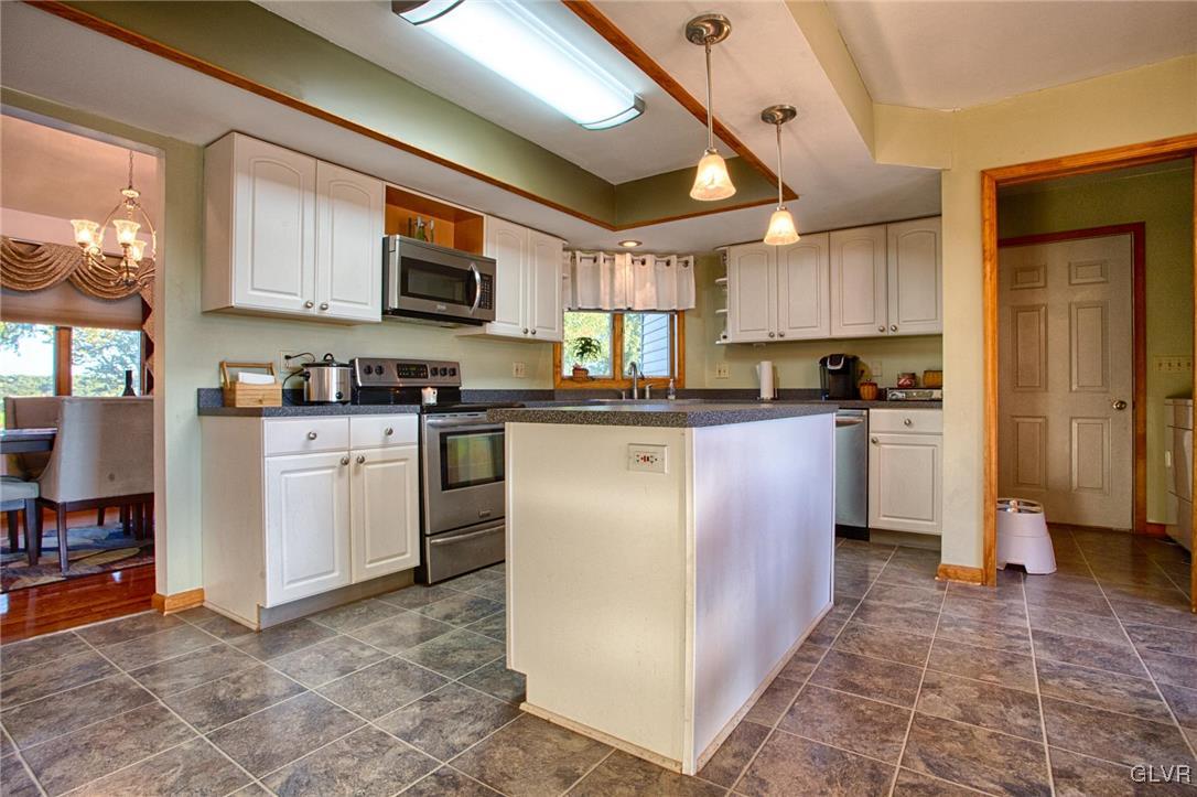 455 Bauer Road Bath, PA 18014 - Photo 4 of 26 a kitchen with stainless steel appliances granite countertop a sink a stove a refrigerator cabinets and a window