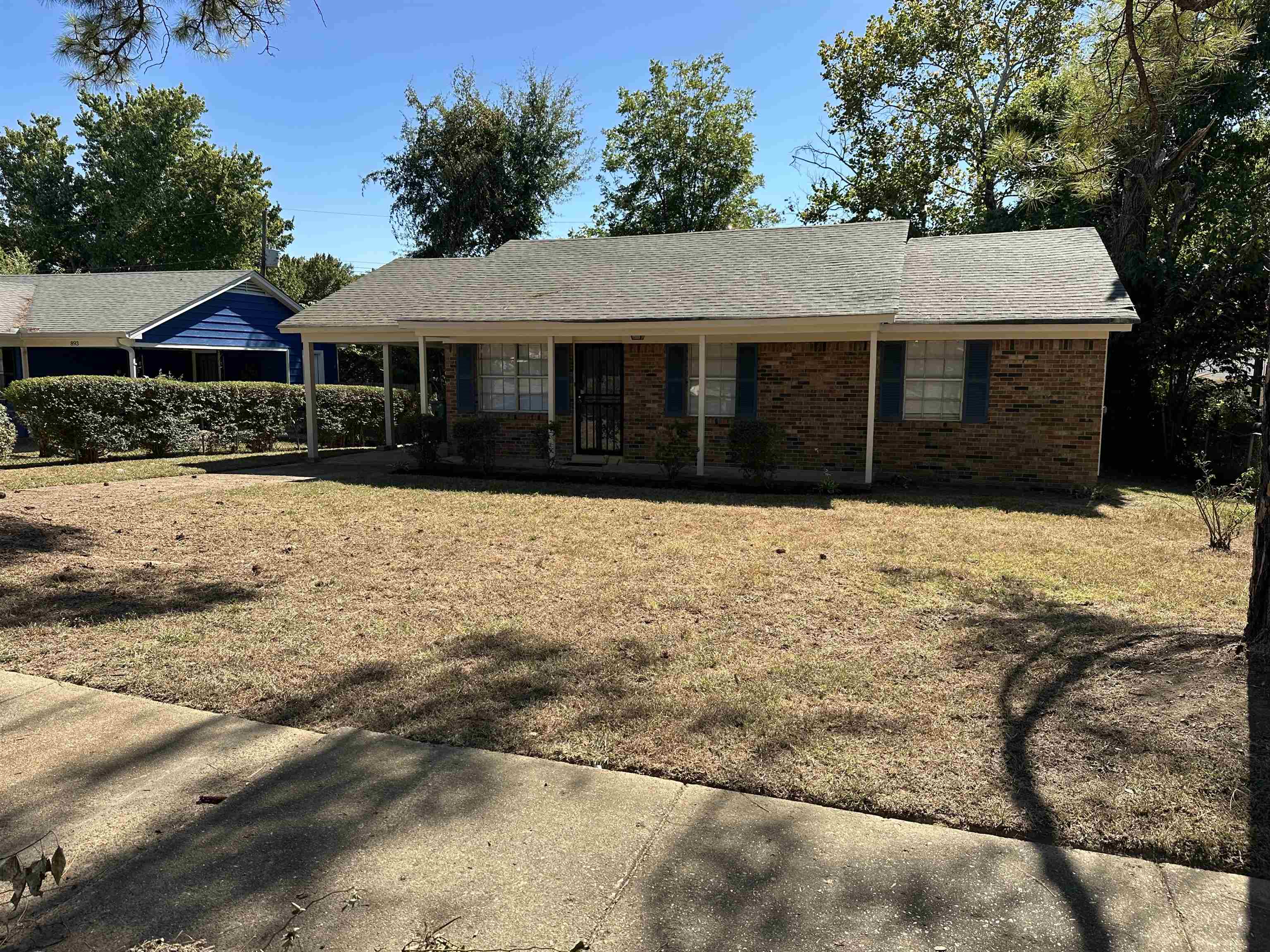 899 West Raines Road Memphis, TN 38109 - Photo 1 of 14 Brick exterior with a covered entry, gabled roof, and decorative shutters